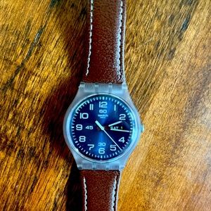 Adult SWATCH watch with new battery, and a leather band